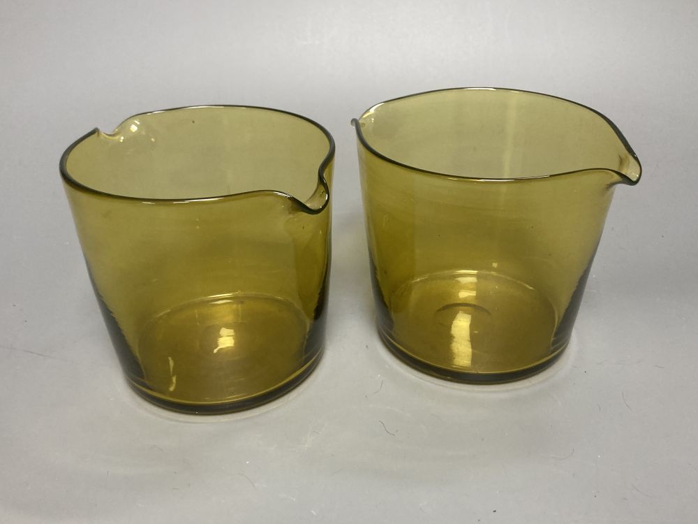 A Bohemian amber flash cut beaker vase, a pair of amber wine glass coolers, 10cm high and a floral painted opaque glass beaker vase, in